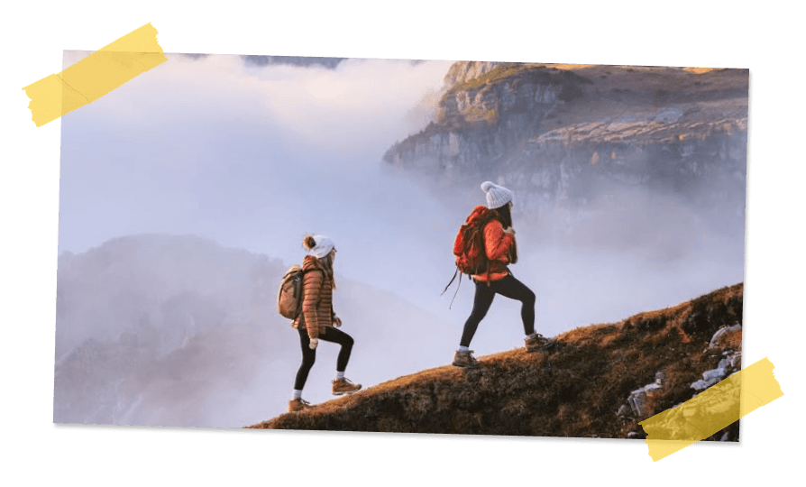 Two hikers on a misty mountain